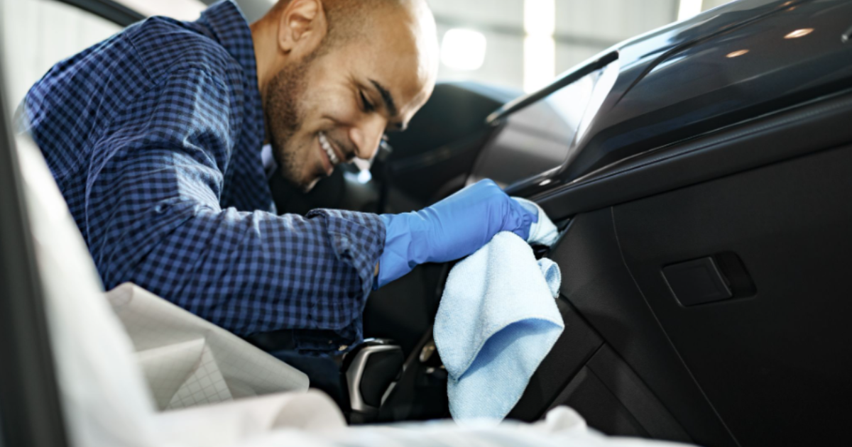 Powerful Auto Repair Software Scheduling: Use It or Lose It 7 auto tech polishing a cars dashboard