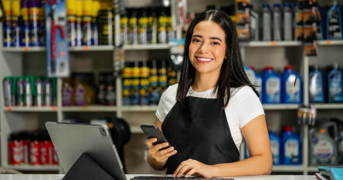 Powerful Auto Repair Software Scheduling: Use It or Lose It 5 happy dealership employee at a front desk