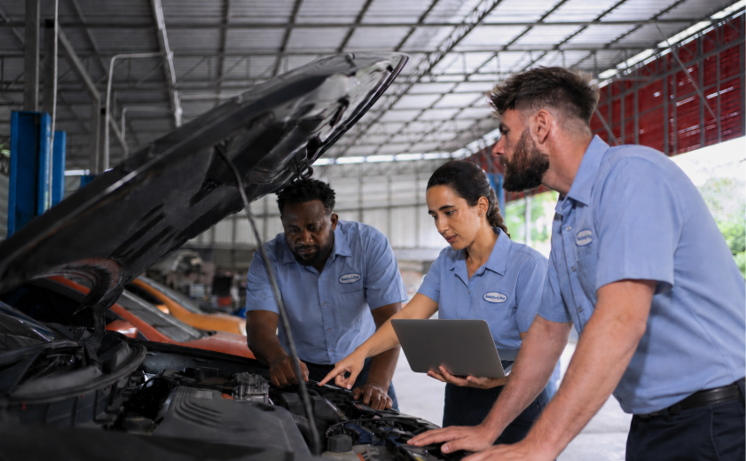 Workflow 360° Streamlines Auto Service Operations, Which Helps You Attract and Retain Skilled Technicians 1 skilled fixed ops technicians working on a car at a dealership