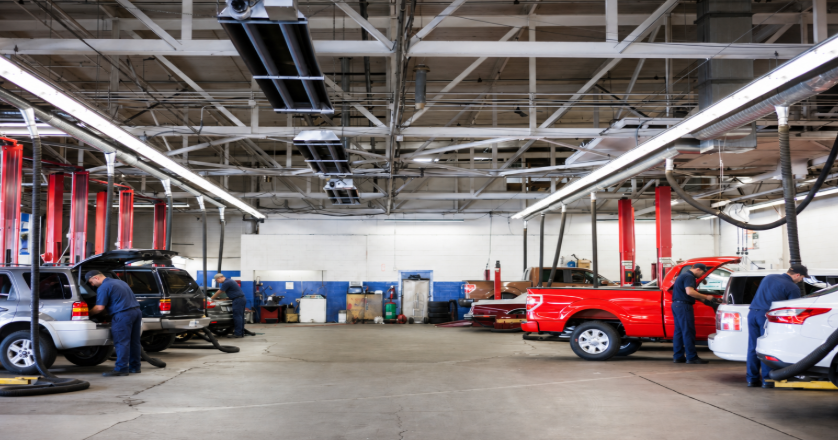 Workflow 360° Streamlines Auto Service Operations, Which Helps You Attract and Retain Skilled Technicians 2 auto-dealer shop with all bays full and technicians working on each car.
