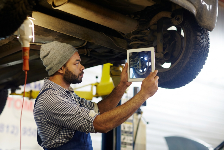 Workflow 360°’s Communications Hub and Document Management System Turns Chaos into Cash 3 auto technician taking a picture of a wheel with his ipad and putting it into the workflow 360 database