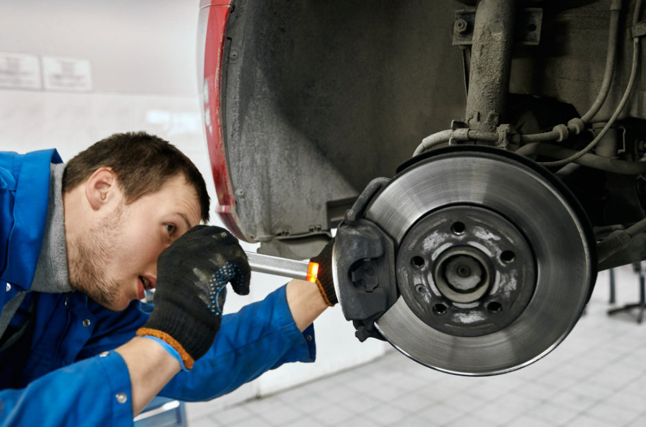 Workflow 360°’s Communications Hub and Document Management System Turns Chaos into Cash 7 auto technician examining a wheel hub