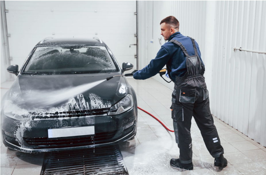 Workflow 360°’s Communications Hub and Document Management System Turns Chaos into Cash 8 auto technician spraying off a car in the cleaning bay