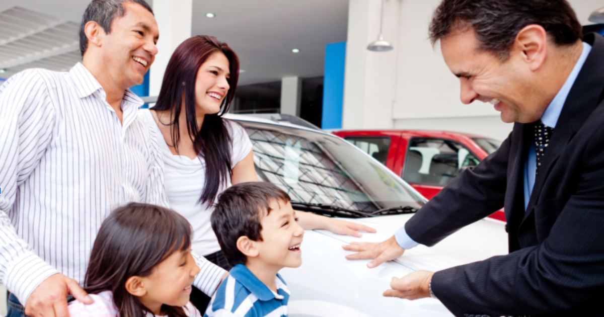 Powerful Auto Repair Software Scheduling: Use It or Lose It 1 auto dealer with a family standing next to a car